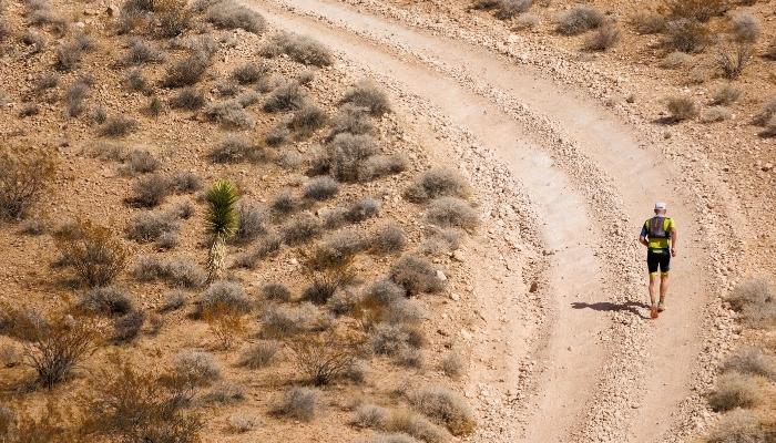 Runner running on gravel road