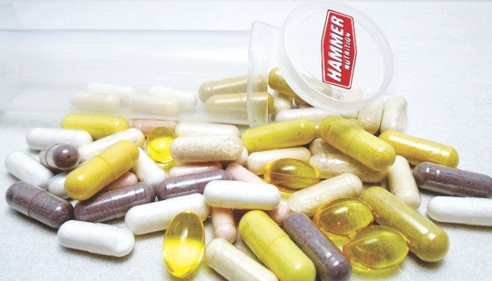 Hammer Nutrition Supplements next to capsule dispenser