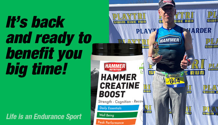 Hammer Athlete on a podium holding a trophy with Creatine Boost product in middle of image.