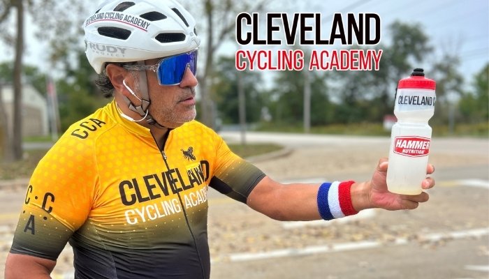 Cleveland Cyling team member holding Hammer Nutrition water bottle