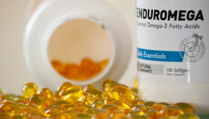 Supplement Capsules next to Bottle