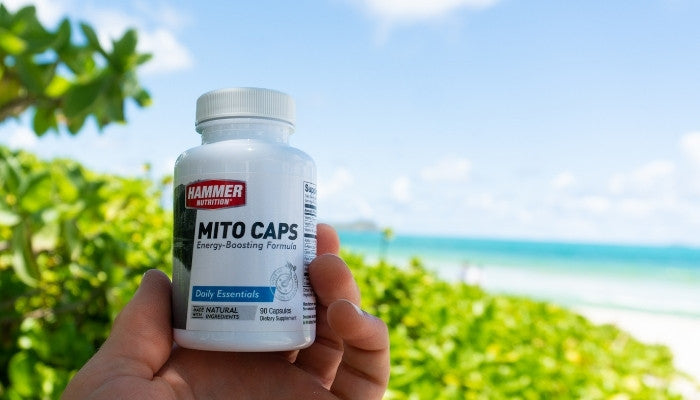 Mito Caps bottle in hand at the beach